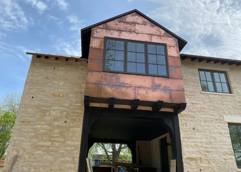 Copper metal panel facade on a stone building for Skylight Installation in Cedarhurst