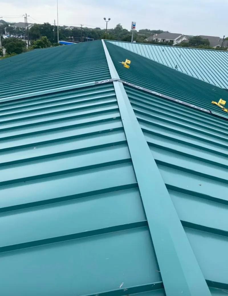 Green commercial metal roof ridge and valley for Metal Roof Repair in Cedarhurst
